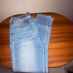 High waisted light wash denim jeans.